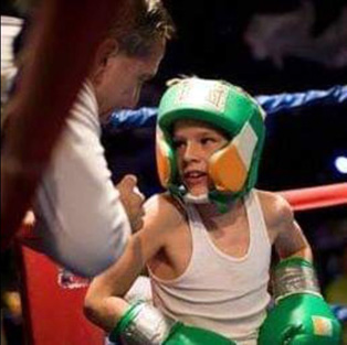 Coach Mike Joyce with youth boxer